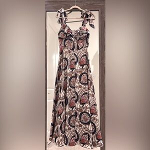 Multi colored maxi dress. Made by Banjul. Size small with self tie straps.